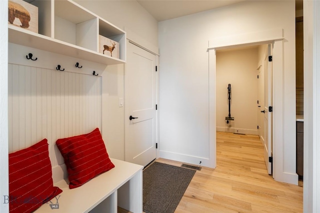 87 Upper Whitefish Dr, Big Sky, MT 59716 - mudroom with light wood-style floors and baseboards