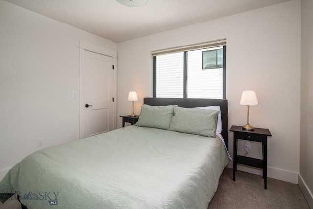 87 Upper Whitefish Dr, Big Sky, MT 59716 - carpeted bedroom featuring baseboards