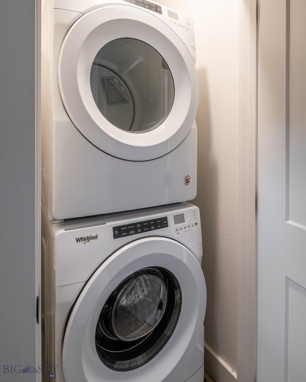 87 Upper Whitefish Dr, Big Sky, MT 59716 - laundry area with stacked washer and clothes dryer