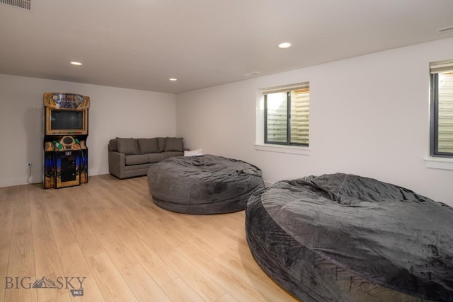 87 Upper Whitefish Dr, Big Sky, MT 59716 - bedroom featuring multiple windows, light wood-style flooring, and recessed lighting