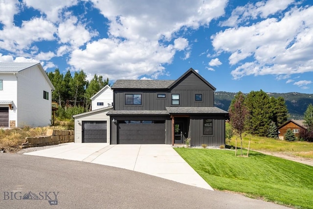 87 Upper Whitefish Dr, Big Sky, MT 59716 - modern inspired farmhouse with board and batten siding, driveway, a garage, and a front yard