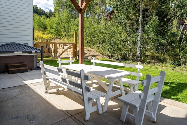 87 Upper Whitefish Dr, Big Sky, MT 59716 - view of patio / terrace featuring outdoor dining space and a hot tub