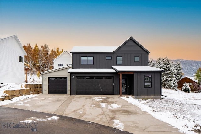 87 Upper Whitefish Dr, Big Sky, MT 59716 - modern farmhouse style home with board and batten siding, driveway, and a garage