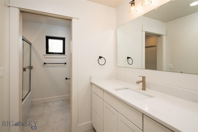 87 Upper Whitefish Dr, Big Sky, MT 59716 - full bath with vanity and shower / bath combination with glass door