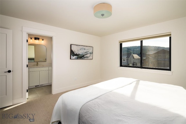 87 Upper Whitefish Dr, Big Sky, MT 59716 - bedroom featuring light carpet and ensuite bathroom