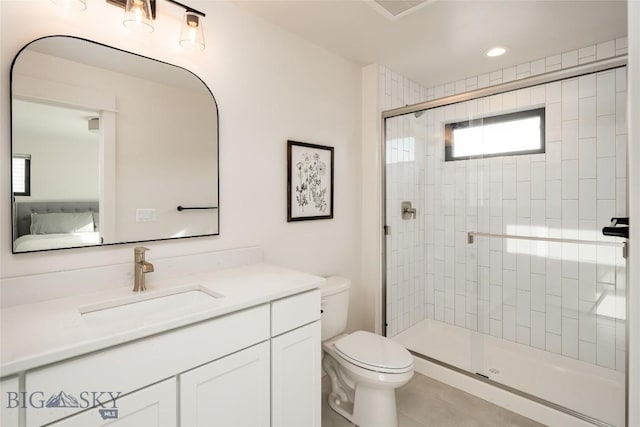 87 Upper Whitefish Dr, Big Sky, MT 59716 - ensuite bathroom featuring a shower stall, vanity, and tile patterned flooring