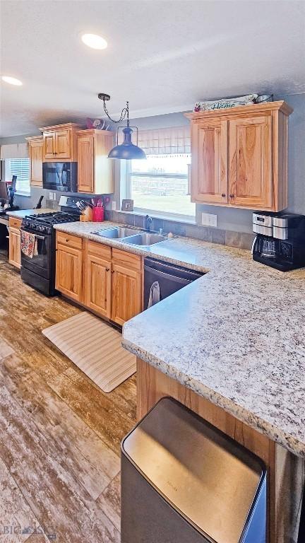 950 N Harrison St, Lima, MT 59739 - kitchen with black appliances and light wood-style floors