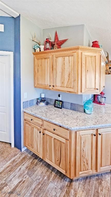 950 N Harrison St, Lima, MT 59739 - kitchen featuring light brown cabinets and light wood-style floors