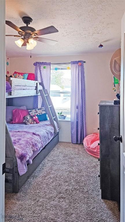 950 N Harrison St, Lima, MT 59739 - carpeted bedroom featuring a textured ceiling and ceiling fan