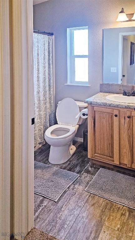 950 N Harrison St, Lima, MT 59739 - full bath with wood finished floors and vanity
