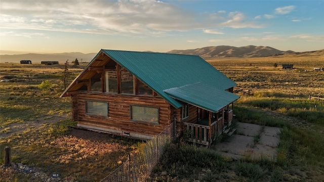7223 Birdseye Rd, Helena, MT 59602 - view of front of property featuring a mountain view, log exterior, and a metal roof