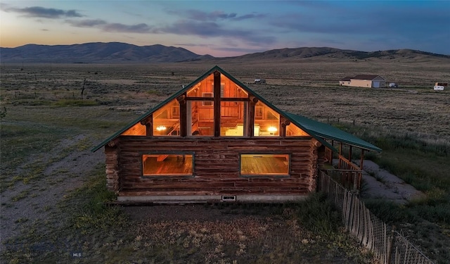 7223 Birdseye Rd, Helena, MT 59602 - property exterior at dusk with log exterior and a mountain view