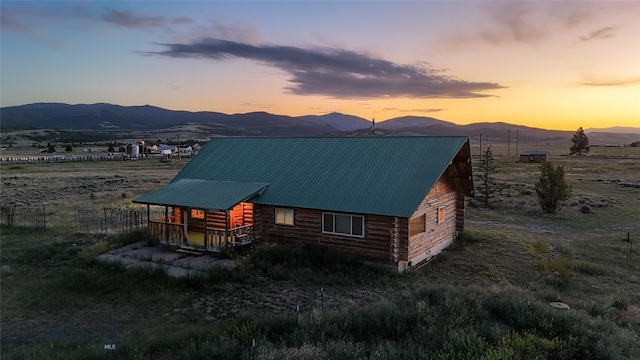 7223 Birdseye Rd, Helena, MT 59602 - view of front of home with a mountain view, log siding, and a metal roof