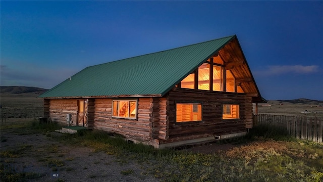 7223 Birdseye Rd, Helena, MT 59602 - view of side of home with log exterior and a metal roof