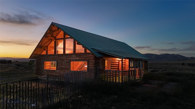 7223 Birdseye Rd, Helena, MT 59602 - property exterior at dusk with a metal roof