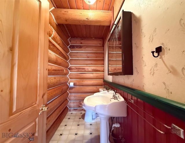 7223 Birdseye Rd, Helena, MT 59602 - bathroom with rustic walls, wooden ceiling, and tile patterned floors