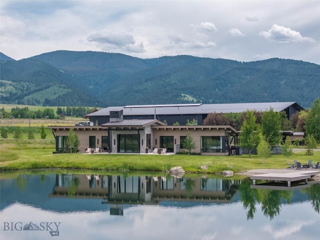 240 Horsetail Rd, Bozeman, MT 59715 - rear view of house featuring a water and mountain view, a yard, and a metal roof