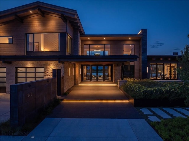 240 Horsetail Rd, Bozeman, MT 59715 - back of house featuring driveway and an attached garage