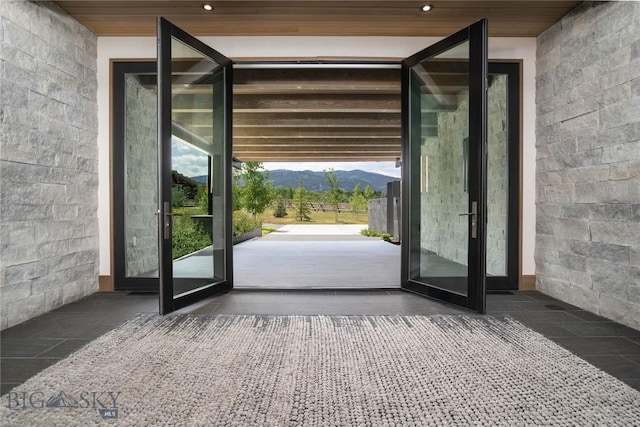 240 Horsetail Rd, Bozeman, MT 59715 - doorway to outside featuring a mountain view, recessed lighting, and wood ceiling