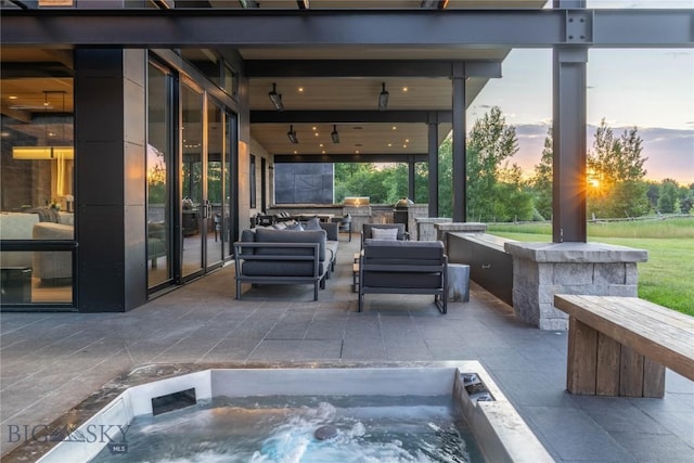 240 Horsetail Rd, Bozeman, MT 59715 - view of patio featuring area for grilling, an outdoor hot tub, and an outdoor living space