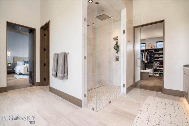 240 Horsetail Rd, Bozeman, MT 59715 - full bath featuring connected bathroom, a stall shower, and a walk in closet