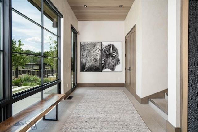 240 Horsetail Rd, Bozeman, MT 59715 - hall featuring plenty of natural light, light tile patterned floors, wood ceiling, and recessed lighting