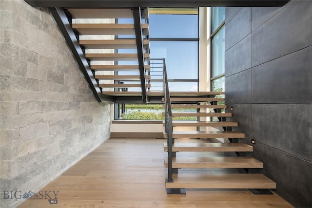 240 Horsetail Rd, Bozeman, MT 59715 - staircase featuring wood finished floors and concrete block wall