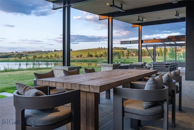 240 Horsetail Rd, Bozeman, MT 59715 - view of patio / terrace featuring a water view, outdoor dining area, and outdoor lounge area