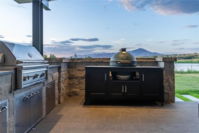 240 Horsetail Rd, Bozeman, MT 59715 - view of patio / terrace with exterior kitchen and a water view
