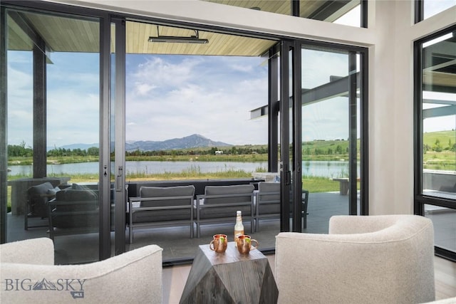 240 Horsetail Rd, Bozeman, MT 59715 - living area featuring healthy amount of natural light, a water and mountain view, and french doors