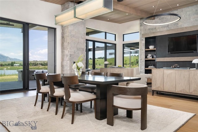 240 Horsetail Rd, Bozeman, MT 59715 - dining area with a towering ceiling, a wood ceiling with exposed beams, healthy amount of natural light, light wood-style floors, and recessed lighting