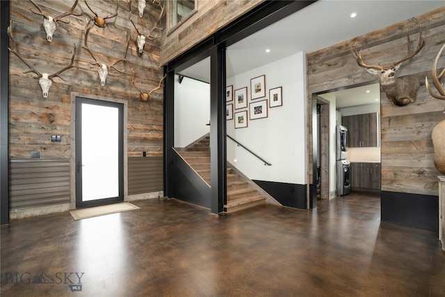 240 Horsetail Rd, Bozeman, MT 59715 - spare room with concrete floors, stairs, wood walls, and recessed lighting