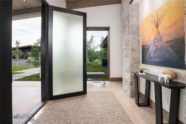 240 Horsetail Rd, Bozeman, MT 59715 - entryway with baseboards and beamed ceiling