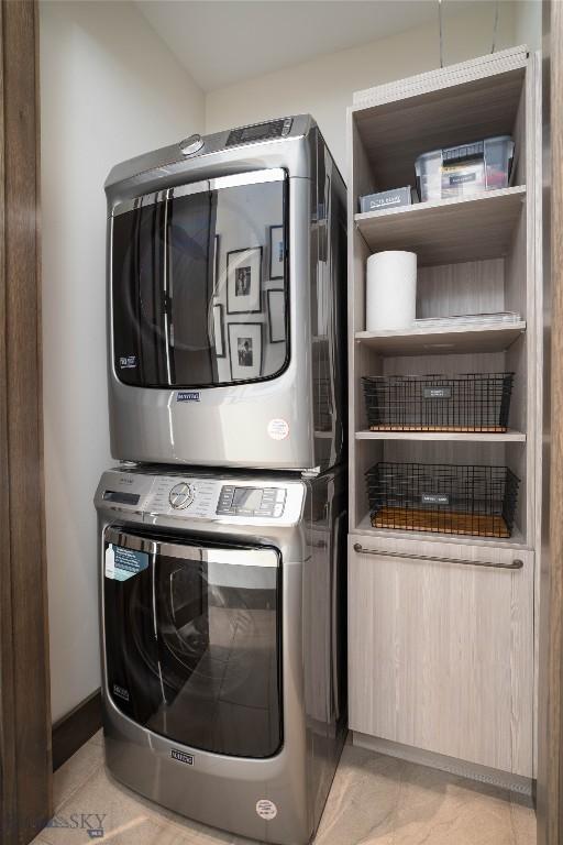 240 Horsetail Rd, Bozeman, MT 59715 - laundry area with stacked washer and clothes dryer and light tile patterned flooring