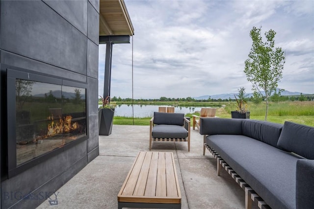 240 Horsetail Rd, Bozeman, MT 59715 - view of patio / terrace with an outdoor living space and a water and mountain view