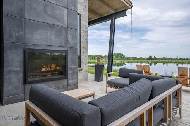240 Horsetail Rd, Bozeman, MT 59715 - view of patio / terrace featuring a water view and an outdoor living space with a fireplace