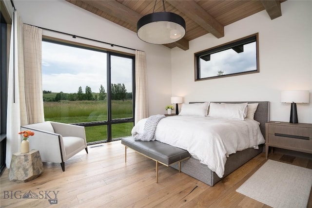 240 Horsetail Rd, Bozeman, MT 59715 - bedroom with a wood ceiling with exposed beams, wood finished floors, and access to outside