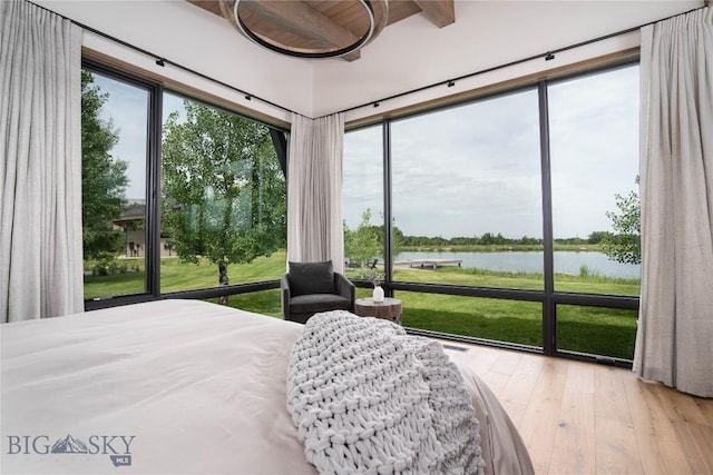 240 Horsetail Rd, Bozeman, MT 59715 - bedroom with a water view, hardwood / wood-style flooring, and beamed ceiling
