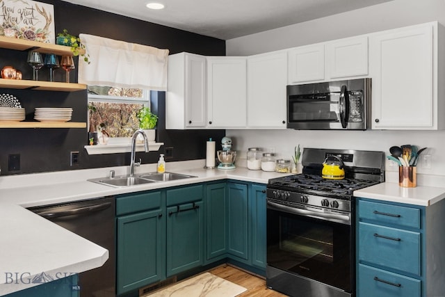 119 Meadow Brook Ln, Belgrade, MT 59714 - kitchen featuring stainless steel appliances, white cabinets, light countertops, and recessed lighting