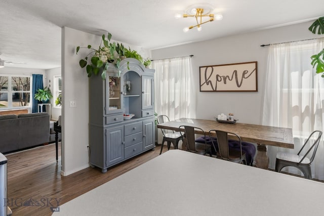119 Meadow Brook Ln, Belgrade, MT 59714 - dining space with dark wood-style flooring and a chandelier