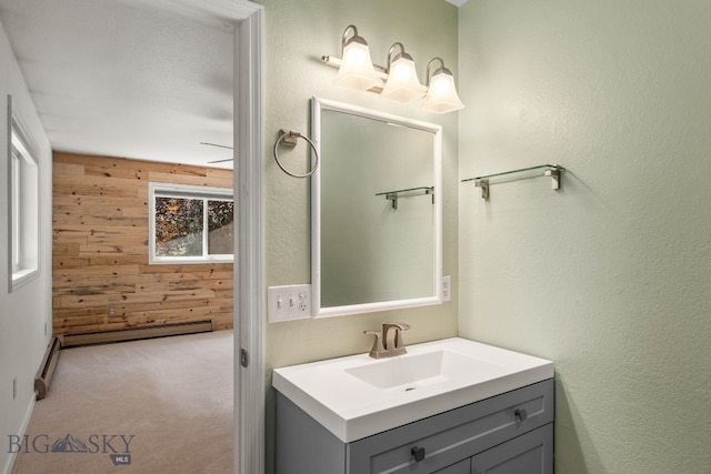 840 Damarell Rd, Bozeman, MT 59718 - bathroom featuring wooden walls, vanity, and baseboard heating