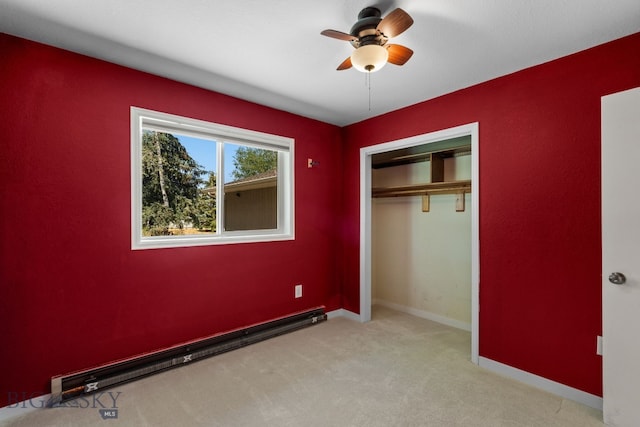 840 Damarell Rd, Bozeman, MT 59718 - unfurnished bedroom featuring baseboard heating, light carpet, a closet, and ceiling fan