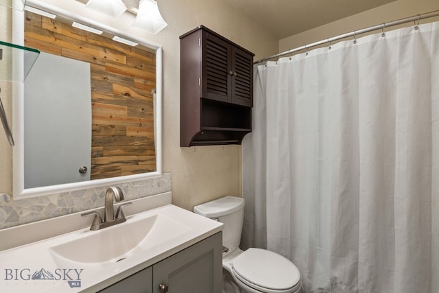 840 Damarell Rd, Bozeman, MT 59718 - full bathroom featuring vanity, backsplash, and a shower with curtain