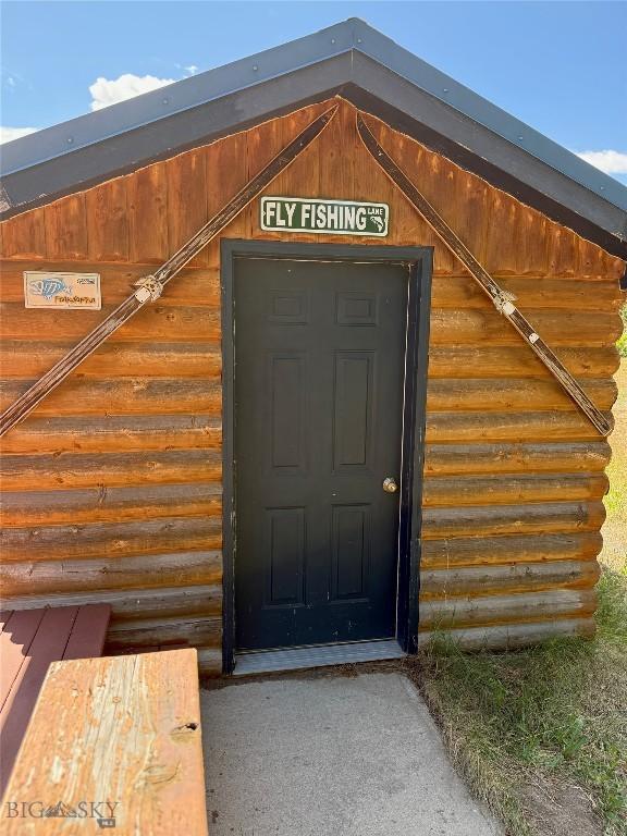 1364 Mcclellan Rd, West Yellowstone, MT 59758 - view of exterior entry featuring log exterior