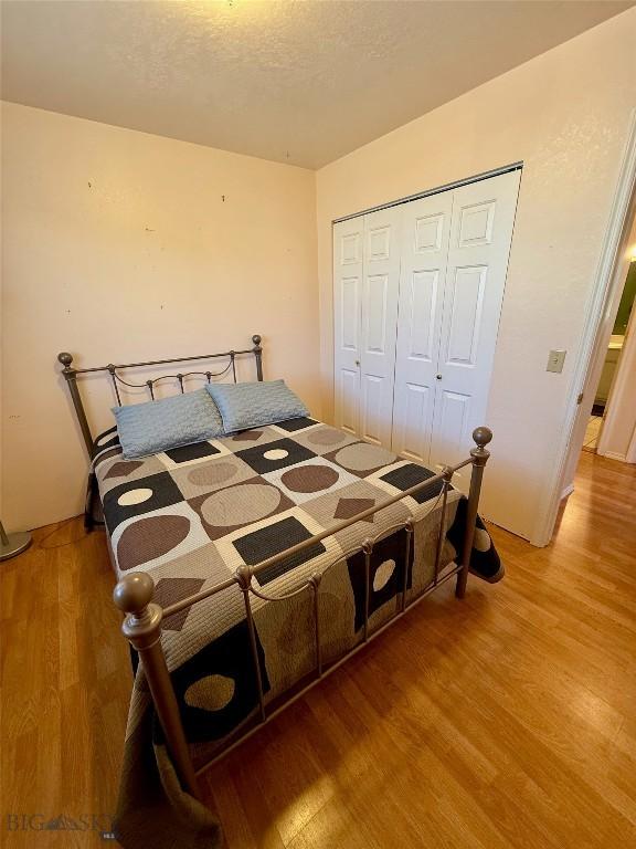 1364 Mcclellan Rd, West Yellowstone, MT 59758 - bedroom featuring wood finished floors and a closet