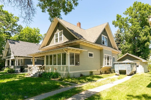 511 W Babcock, Bozeman, MT 59715 - rear view of house featuring a chimney, a lawn, and roof with shingles