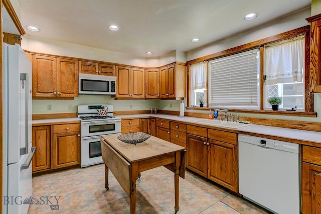 511 W Babcock, Bozeman, MT 59715 - kitchen featuring white appliances, brown cabinets, light countertops, and recessed lighting