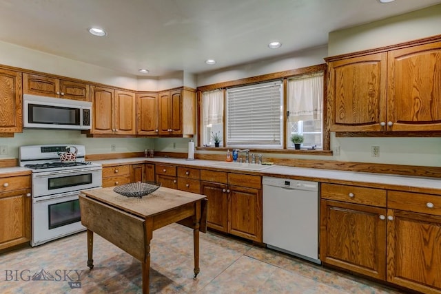 511 W Babcock, Bozeman, MT 59715 - kitchen featuring white appliances, brown cabinetry, light countertops, and recessed lighting