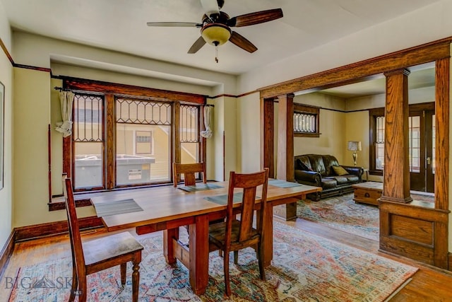 511 W Babcock, Bozeman, MT 59715 - dining area featuring decorative columns, wood finished floors, and a ceiling fan