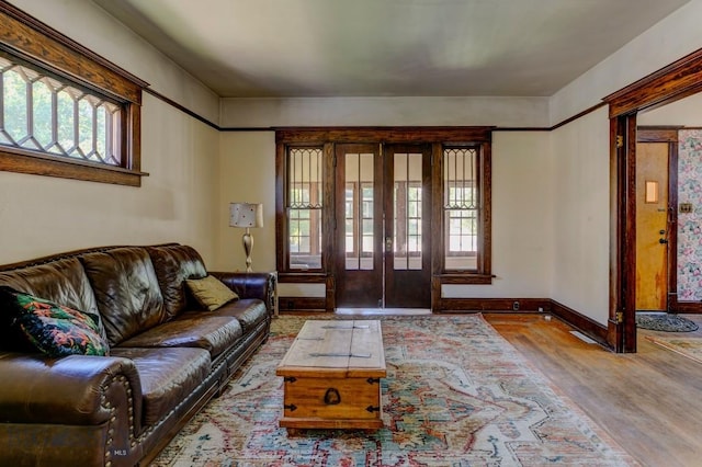 511 W Babcock, Bozeman, MT 59715 - living area featuring wood finished floors, plenty of natural light, and french doors